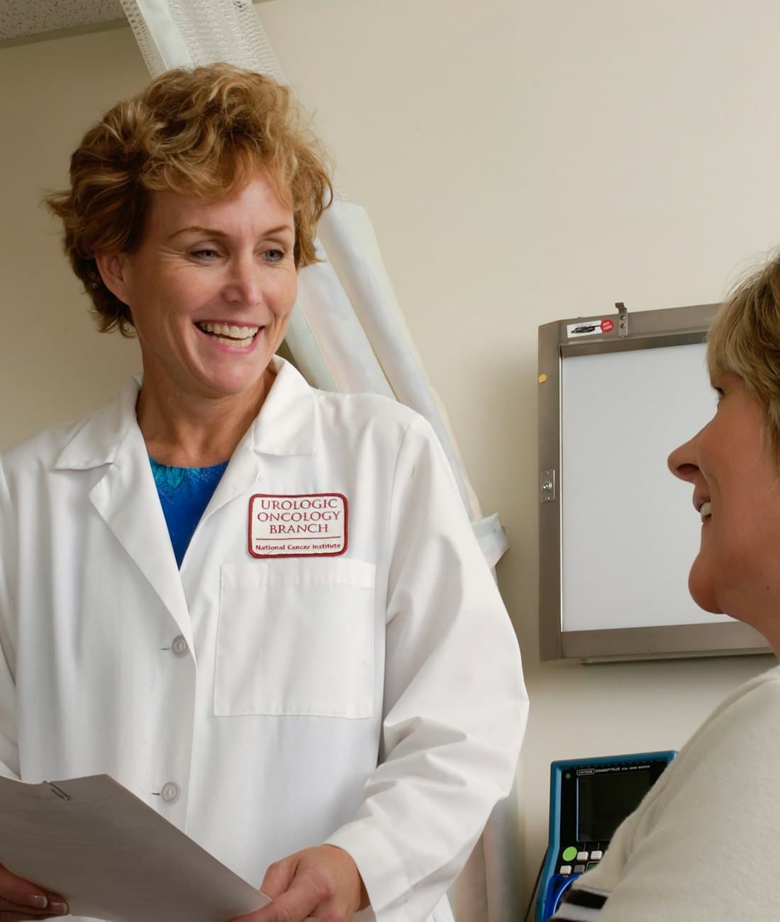 A doctor talking with a patient in the consulting room